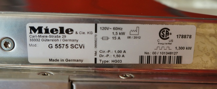 The model number information is located on the side of the Miele G 5575 SC's door.