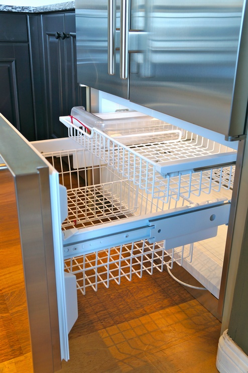 The pullout freezer has two wire drawers and a removable ice bin.