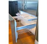 The pullout freezer has two wire drawers and a removable ice bin.