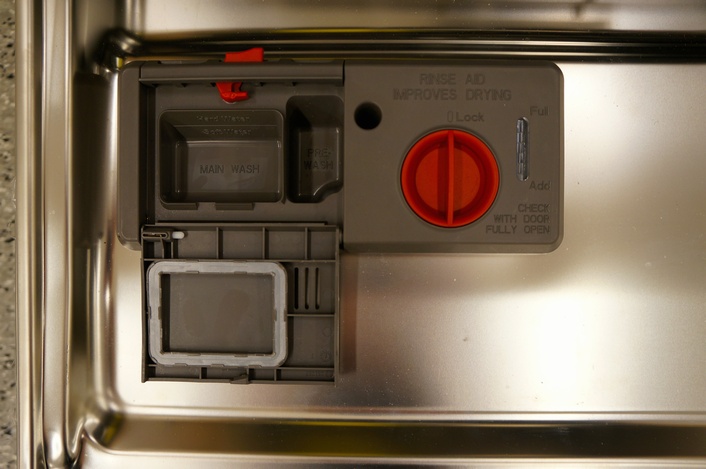The detergent and rinse aid dispensers on the Kenmore Elite 12793.