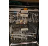 The dishwasher features a 3-tier rack system with Miele's FlexiCare Premium basket configuration and their 3D Cutlery Tray on top.