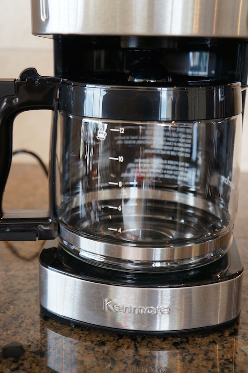 The Kenmore 12-Cup Programmable Aroma Control Coffee Maker uses classic glass carafe and warming plate technology.