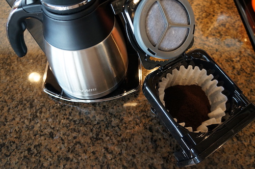 Preparing to brew using a paper filter in the flat-bottomed brew basket.